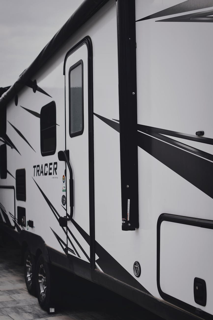 black and white photo of a camper