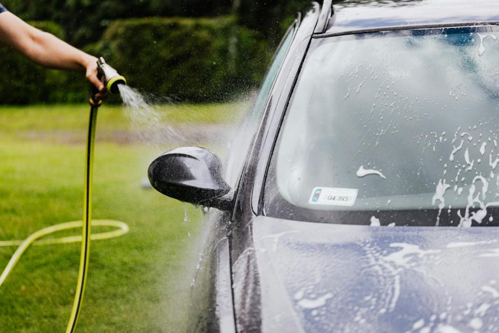 a person washing a car