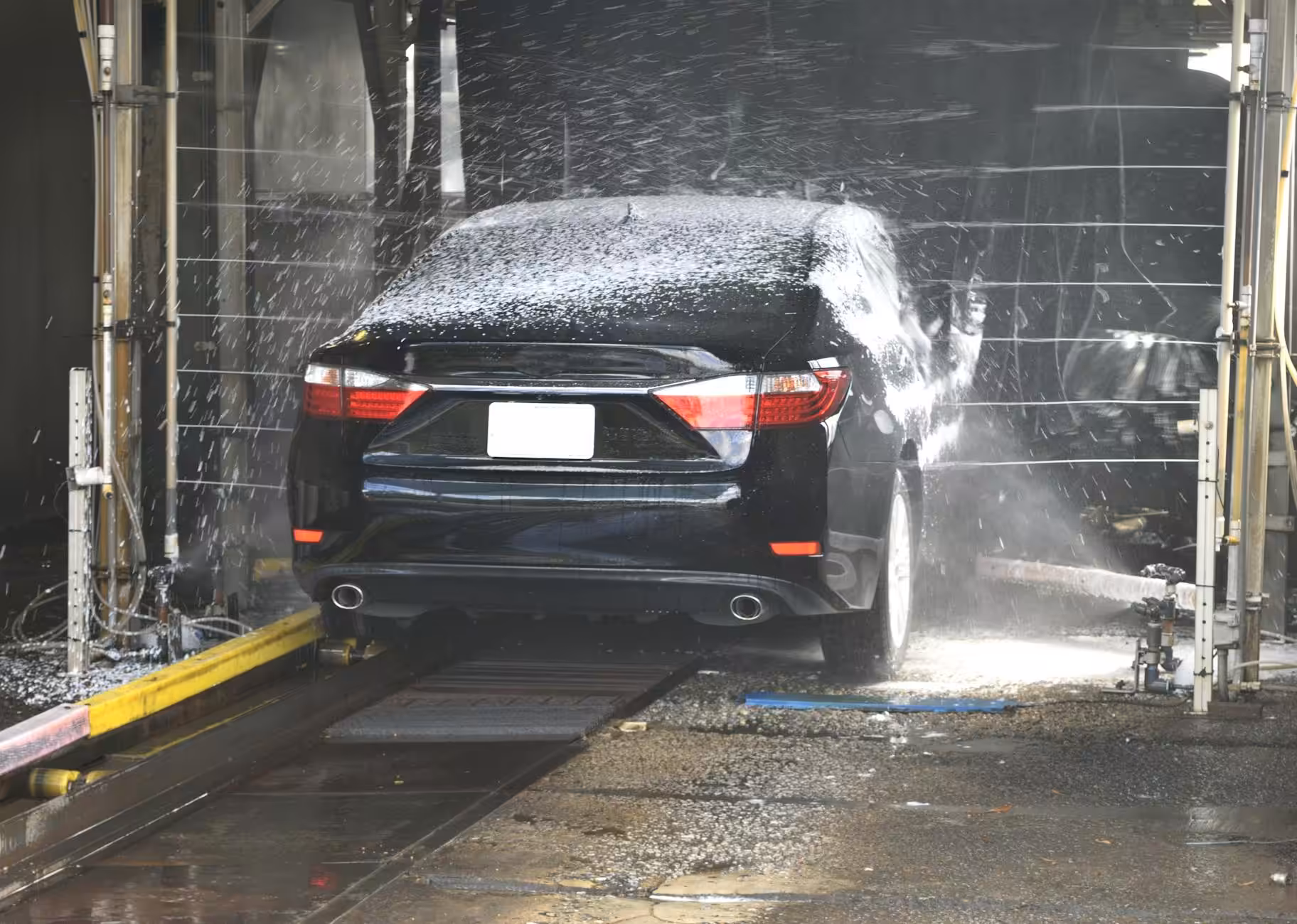 carwashed black sedan