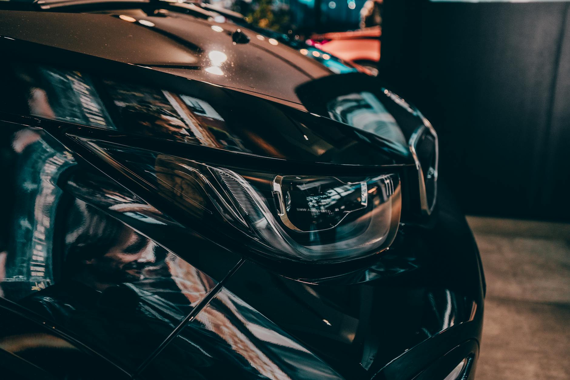 shallow focus photography of black car fender