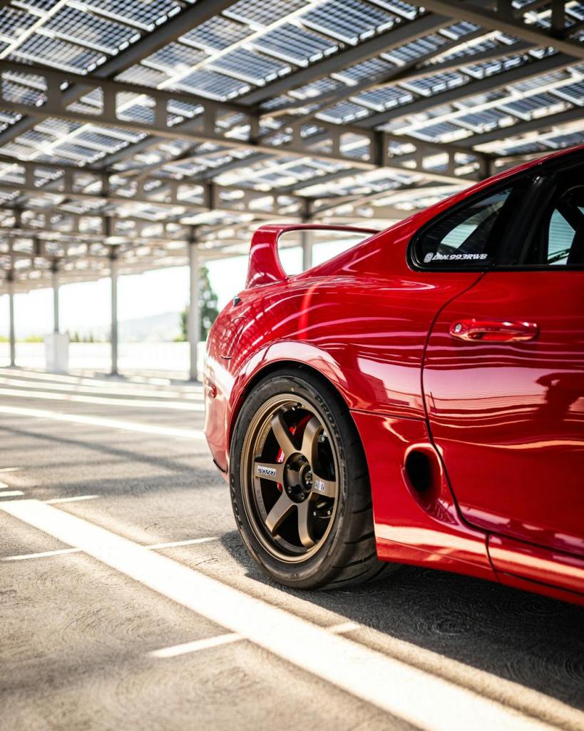 sleek red sports car in modern solar garage